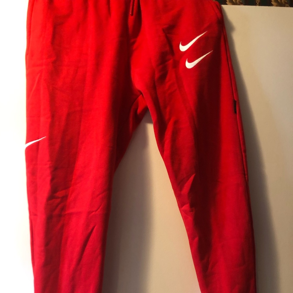 Red Nike double swoosh joggers